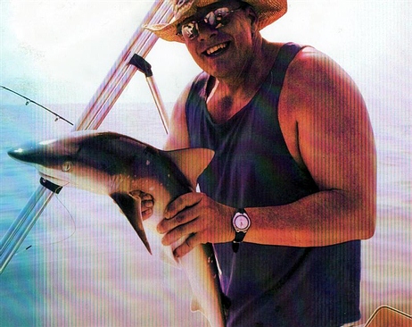 Scan of photo of me with shark on Doug's boat